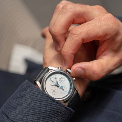 Man altering the time on his wristwatch